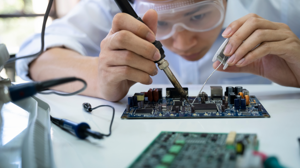 Horizontal-Technician-checks-the-electronic-device.-Printed-circuit-board-for-the-robot.webp